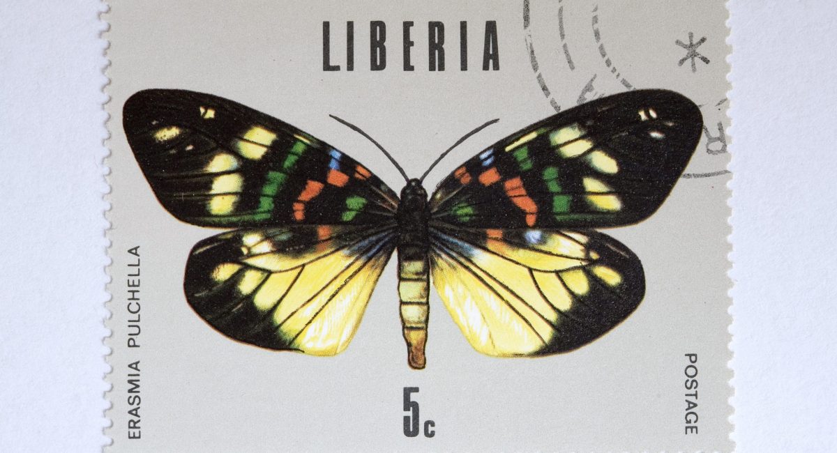 Close up of liberian post stamp showing a butterfly
